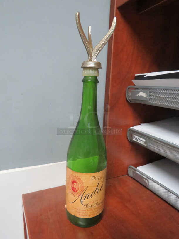 One Andre Champagne Bottle With Topper.