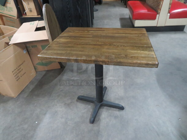 One Square Solid Wooden Table Top On A Pedestal Base. 30X24X29