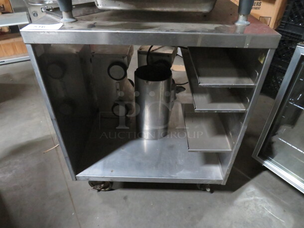 One Stainless Steel Work Station On Casters. 28X29X33