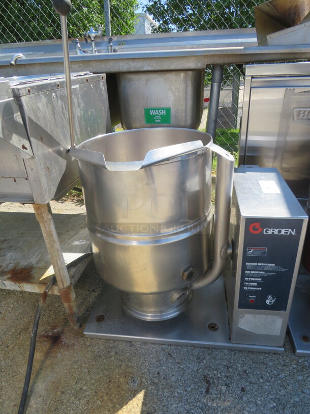 One Groen Table Top 10 Gallon Steam Kettle. Model# TDB40C. 208 Volt. 1 Phase. 28X22X29. Working When Removed! $19,290.00 - Image 1 of 2