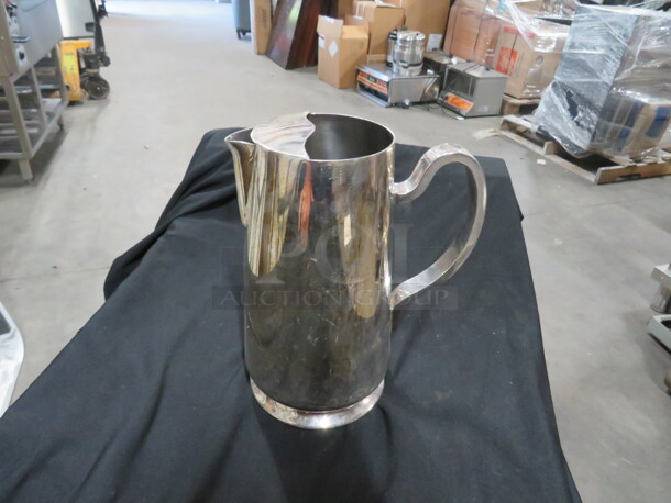 One Vintage DW Haber And Son Silver Plated Pitcher. 