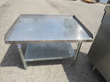 One Stainless Steel Equipment Table With Under Shelf. 36X28X25