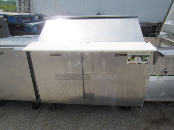 One Traulsen 2 Door Prep Table With Cutting Board, And  1 Rack On Casters. 115 Volt. Model# UPT4818-LR. 48X30X46. $5660.00