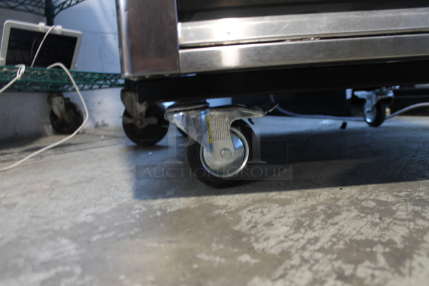 Turbo Air TSR-23SD Stainless Steel Commercial Single Door Reach In Cooler w/ Poly Coated Racks on Commercial Casters. 110-120 Volts, 1 Phase. Tested and Powers On But Does Not Get Cold - Image 3 of 6