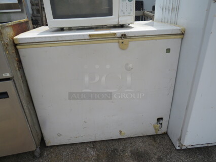 One GE Chest Freezer. Model# FCM7DNBWH. 115 Volt. 38X22X33