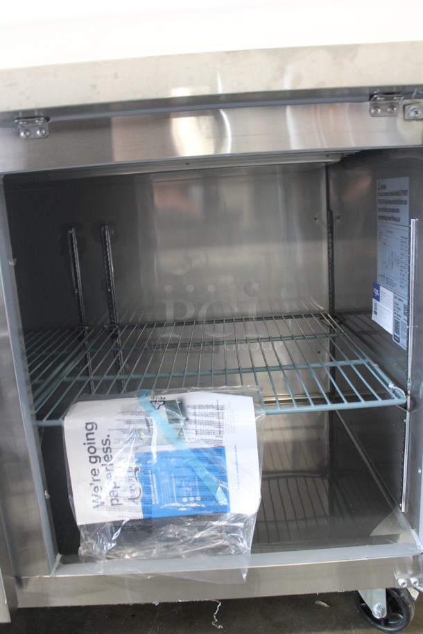 BRAND NEW SCRATCH AND DENT! 2023 Avantco 178SSPPT260 Stainless Steel Commercial Pizza Prep Table on Commercial Casters. 115 Volts, 1 Phase. Tested and Does Not Power On - Image 7 of 9