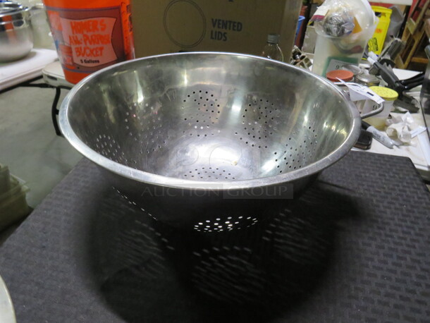 One 14 Inch Stainless Steel Colander.