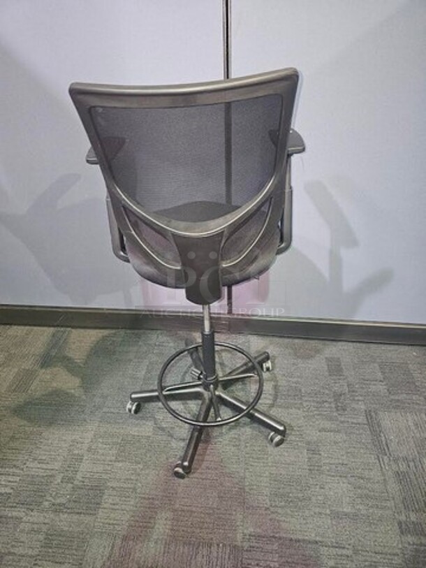 Tall black desk chair on wheels made by Henglin Home Furnishings Co. LTD. Features armrests and is adjustable height. In good used conditions- minor signs of wear. No rips, holes or broken pieces. Measures 52” H x 25” W.  

 - Image 3 of 4