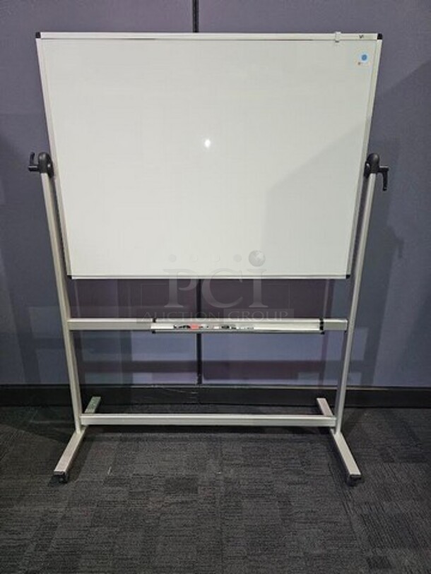VizPro Dry erase whiteboard on wheels with silver metal framing. Double sided. In good used condition- not broken. 69"H x 52"W x 22"D - Image 1 of 3