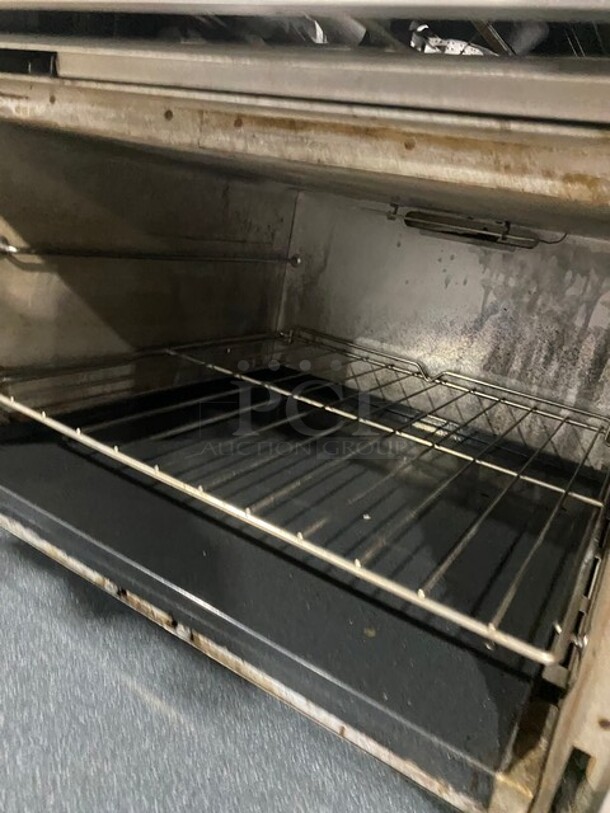 SouthBend Commercial Natural Gas Powered Split Top 4 Burner Stove! With Left Side Flat Griddle! With Full Sized Oven Underneath! With Backsplash! All Stainless Steel! With Metal Oven Racks! On Casters! Model: X336D-1GL SN: 04C65469! - Image 10 of 12