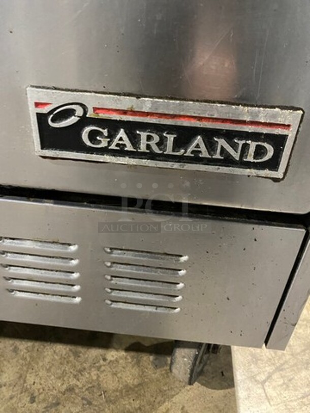 Garland Natural Gas Powered 10 Burner Stove! With 2 Full-Sized Convection Ovens! With Metal Oven Racks! With Raised Back Splash & Salamander Shelf! Stainless Steel! On Casters! WORKING WHEN REMOVED! - Image 10 of 11