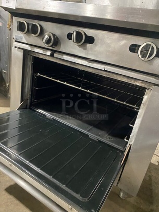 Garland Commercial Natural Gas Powered Hot Plate With Left Side 2 Burner Range! With Raised Splash Back And Salamander Shelf! With Oven Underneath! All Stainless Steel! On Legs! - Image 8 of 9