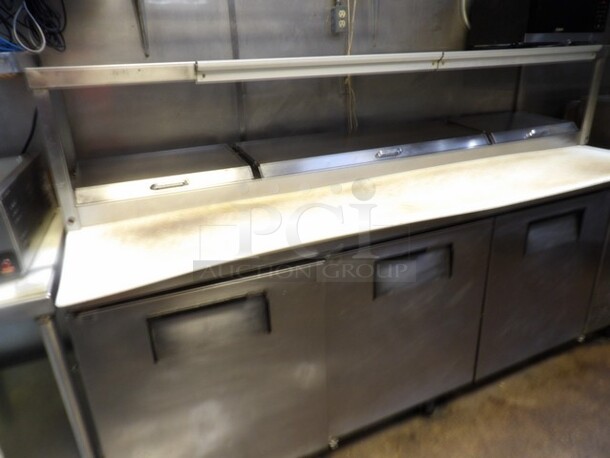 True 3-Door Stainless Pizza/Sandwich Prep Table W/Overhead Shelf. 
TESTED AND WORKING
Model TPP-93
Single Phase - Image 2 of 7