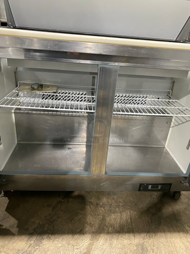 2021 Serv-Ware Prep Table With Commercial Cutting Board And 2 Doors Underneath!  w/ 2 Tier Over Shelf on Commercial Casters! Working When Removed! MODEL SP4812HC SN:21032106  - Image 7 of 12