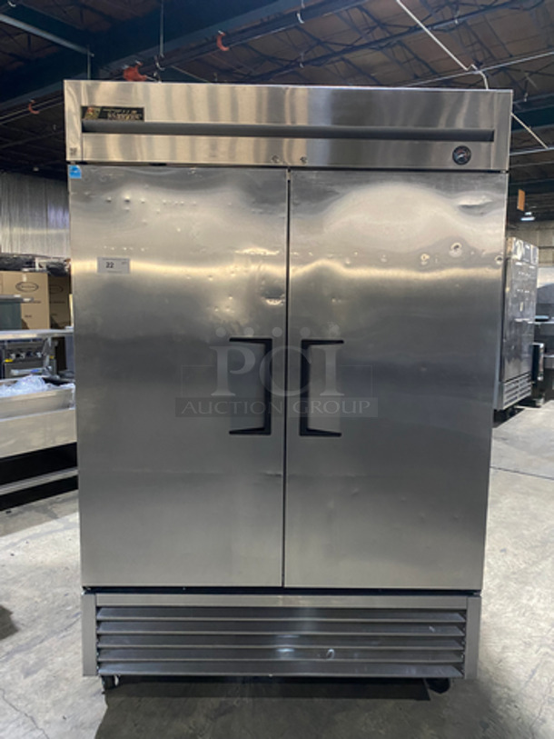 COOL! True Commercial 2 Door Reach In Freezer! With Poly Coated Racks! All Stainless Steel! On Casters! Model: T49F SN: 7701330 115V 60HZ 1 Phase
