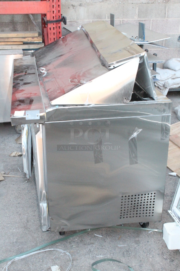 BRAND NEW SCRATCH & DENT! Avantco SS-PT-60M-HC 60" 2 Door Mega Top Stainless Steel Refrigerated Sandwich Prep Table. S/N: 130230645 60-1/4x35x45-7/8 Unit is dented and damaged. See photos. - Image 3 of 6