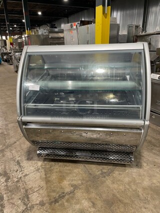 SeVel Commercial Refrigerated Bakery Display Case! With Tempered, Non-Glare, Lift-Up Curved Front Glass!  With Double Sliding Door Rear Access! With Rear Pull Out Loading Drawer! On Casters!