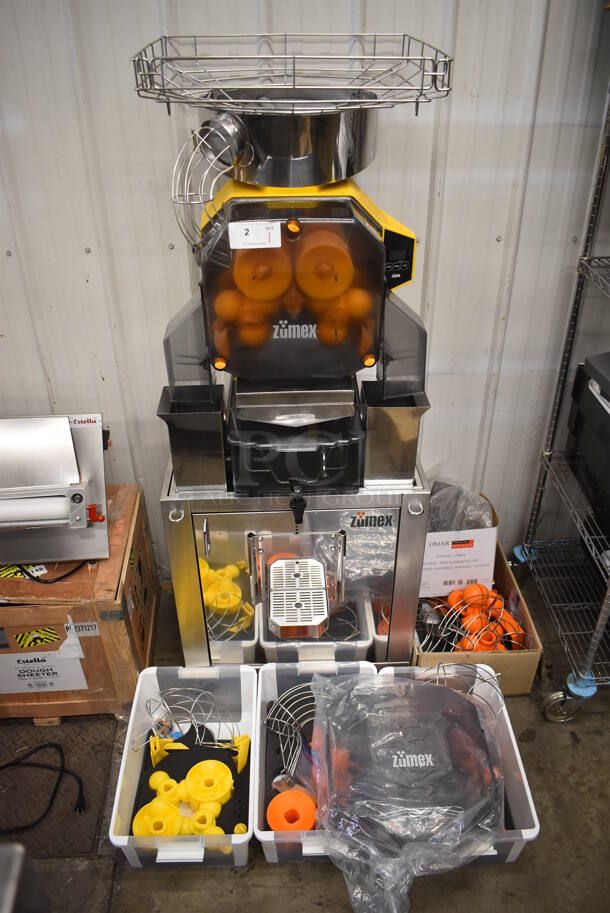 2017 Zumex Speed Pro Tank Podium Stainless Steel Commercial Floor Style Citrus Juicer on Commercial Casters. Comes w/ Extra Pieces: See Pictures For Details! 115 Volts, 1 Phase. 27x21x69. Tested and Working!