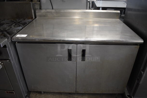 Advance Tabco Stainless Steel Commercial Counter w/ Back Splash, 2 Doors and Under Shelves on Commercial Casters. 48x30x40