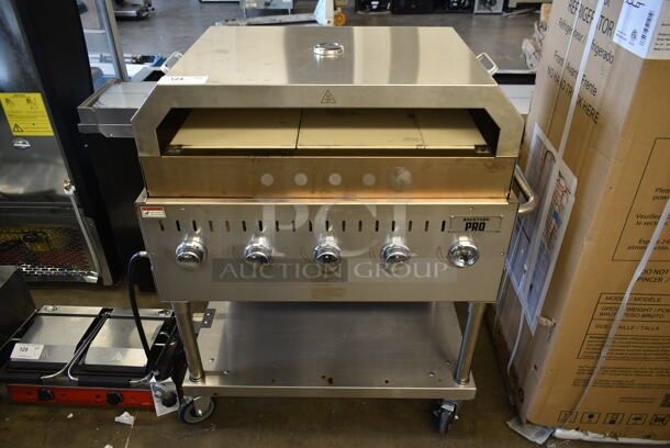 LIKE NEW! 2022 Backyard Pro 554LPG36 Stainless Steel Commercial Propane Gas Powered Outdoor Grill w/ Brick Oven Attachment and Under Shelf on Commercial Casters. Stock Picture Used as Gallery. Tested and Working! - Image 10 of 10
