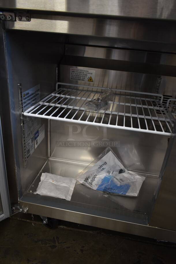 BRAND NEW SCRATCH AND DENT! 2023 Avantco 178SSUC72RHC Stainless Steel Commercial 3 Door Undercounter Cooler on Commercial Casters. 115 Volts, 1 Phase. Tested and Working! - Image 6 of 10