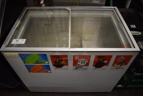 Metal Commercial Chest Freezer Merchandiser on Commercial Casters. Missing 1 Caster. 120 Volts, 1 Phase. 39.5x25x34. Tested and Working!