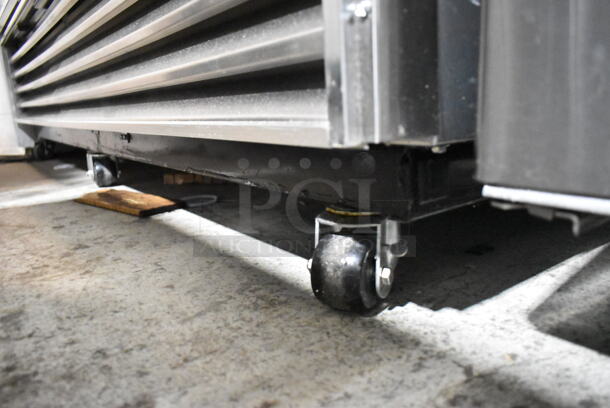 True T-72G Stainless Steel Commercial 3 Door Reach In Cooler Merchandiser w/ Poly Coated Racks on Commercial Casters. 115 Volts, 1 Phase. Tested and Working! - Image 5 of 9