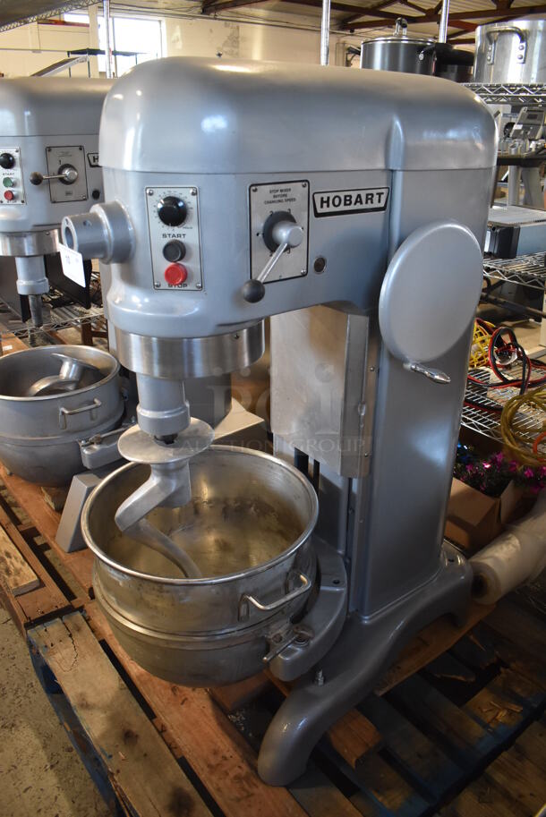 REFURBISHED! Hobart Metal Commercial Floor Style 60 Quart Planetary Dough Mixer w/ Stainless Steel Mixing Bowl and Dough Hook Attachment. Unit Has Been Professionally Refurbished! 208 Volts, 1 Phase. 28x40x56