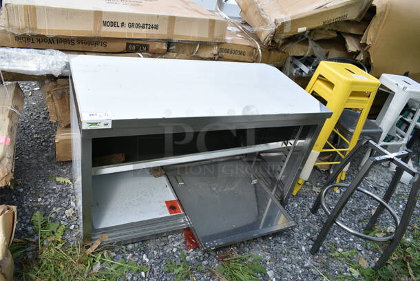 BRAND NEW SCRATCH AND DENT! Regency 600EBT2448D 24" x 48" 16 Gauge Type 304 Stainless Steel Enclosed Base Table with Sliding Doors and Adjustable Midshelf - Image 2 of 4