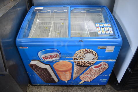 AHT RIO S 100 Metal Commercial Novelty Ice Cream Freezer Merchandiser on Commercial Casters. 115 Volts, 1 Phase. Tested and Working!