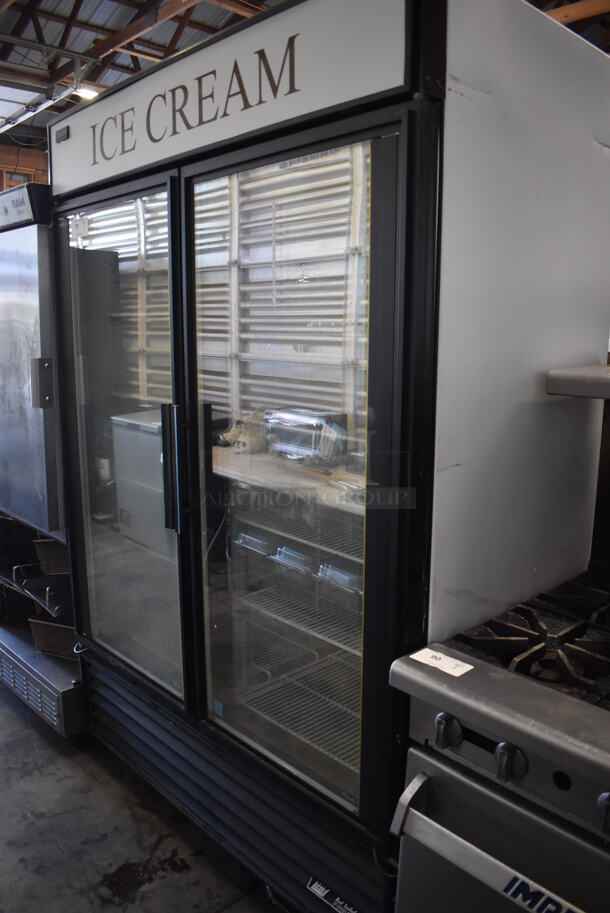 2013 True GDM-49F ENERGY STAR Metal Commercial 2 Door Reach In Freezer Merchandiser w/ Poly Coated Racks on Commercial Casters. 115/208-230 Volts, 1 Phase. 54x32x82. Tested and Working! - Image 2 of 5
