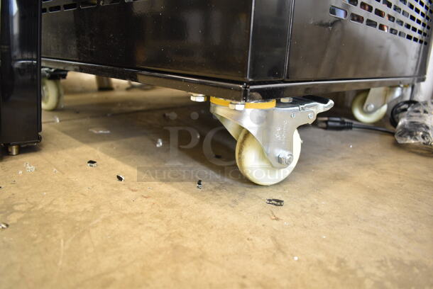 BRAND NEW SCRATCH AND DENT! Avantco 193GD4C15HCB Black 4-Sided Glass Refrigerated Display Case on Commercial Casters. See Pictures for Broken Glass. 110-120 Volts, 1 Phase. Tested and Working! - Image 9 of 10