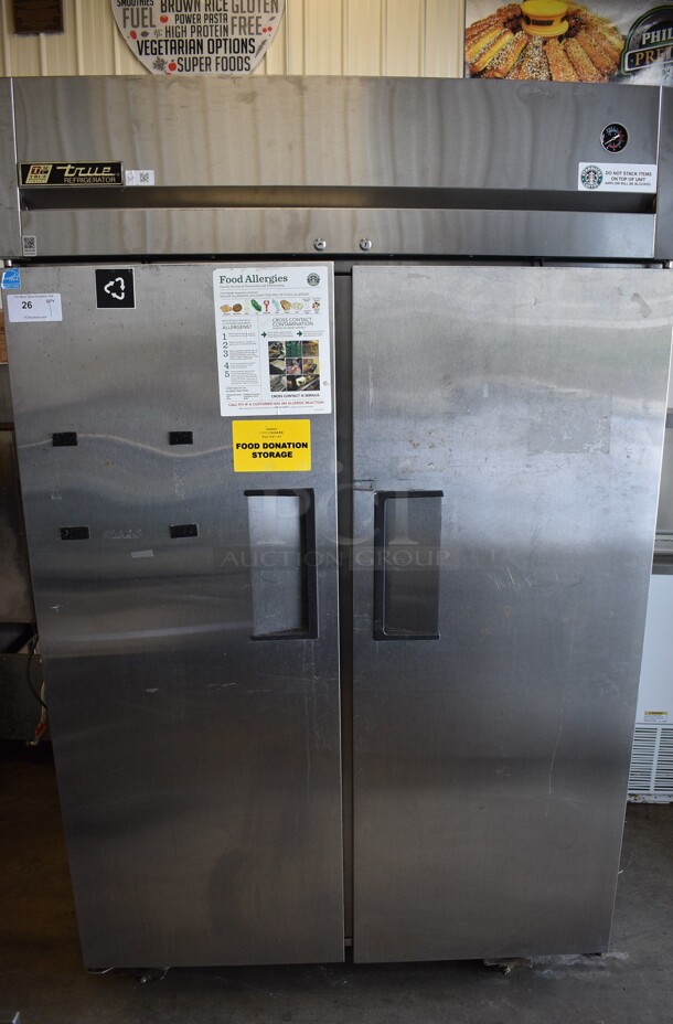 True Model TG2R-2S ENERGY STAR Stainless Steel Commercial 2 Door Reach In Cooler w/ Poly Coated Racks on Commercial Casters. 115 Volts, 1 Phase. 51x35x83. Tested and Powers On But Does Not Get Cold