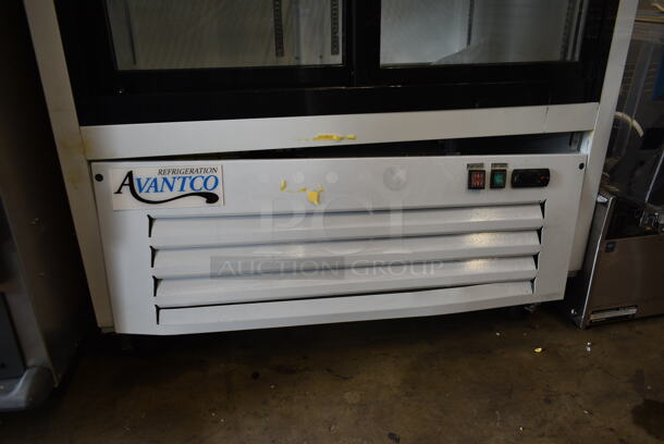 BRAND NEW SCRATCH AND DENT! 2023 Avantco 178GDS33HCW Metal Commercial 2 Door Reach In Cooler Merchandiser w/ Poly Coated Racks on Commercial Casters. 115 Volts, 1 Phase. Cannot Test Due To Cut Power Cord - Image 4 of 9