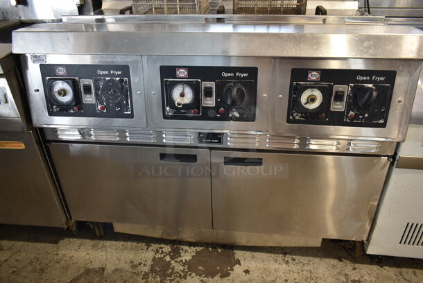 Henny Penny CG-303 Stainless Steel Commercial Floor Style  Natural Gas Powered 3 Bay Deep Fat Fryer w/ 3 Lids and 4 Metal Fry Baskets on Commercial Casters. 240,000 BTU. - Image 2 of 10