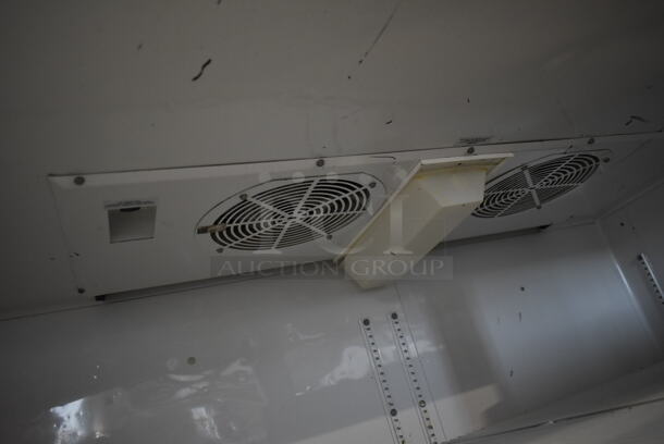 2012 True TG2R-2S ENERGY STAR Stainless Steel Commercial 2 Door Reach In Cooler w/ Poly Coated Racks on Commercial Casters. Doors Need To Be Reattached. 115 Volts, 1 Phase. Tested and Working! - Image 5 of 8