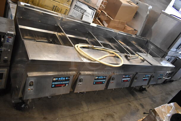 Ultrafryer PAM-2-20 Stainless Steel Commercial Floor Style Natural Gas Powered 4 Bay Deep Fat Fryer on Commercial Casters. 