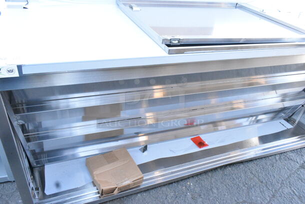BRAND NEW SCRATCH AND DENT! Regency 600EBTB3072D 30" x 72" 16 Gauge Type 304 Stainless Steel Enclosed Base Sliding Door Table with Adjustable Midshelf and 6" Backsplash - Image 3 of 10