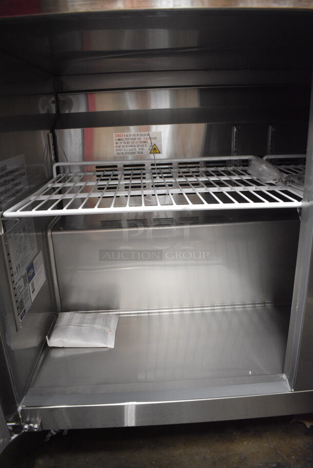 BRAND NEW SCRATCH AND DENT! 2024 Avantco 178SSUC48FHC Stainless Steel Commercial 2 Door Undercounter Freezer on Commercial Casters. 115 Volts, 1 Phase. Tested and Working! - Image 6 of 7