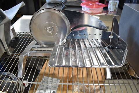Rival Stainless Steel Commercial Countertop Meat Slicer. Tested and Powers On But Parts Do Not Move