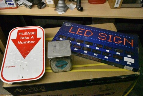 3 Various Items Including Ticket Number Dispenser w/ Number Sign, Scale and LED Light Up Sign. 3 Times Your Bid! 