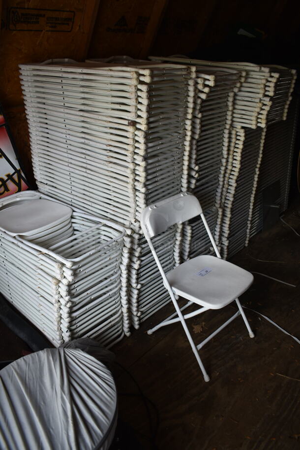 25 White Poly and Metal Folding Chairs. Stock Picture - Cosmetic Condition May Vary. 25 Times Your Bid! BUYER MUST REMOVE.(outside shed)