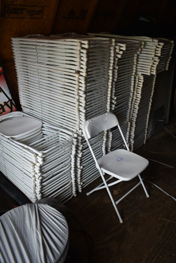 50 White Poly and Metal Folding Chairs. Stock Picture - Cosmetic Condition May Vary. 50 Times Your Bid! BUYER MUST REMOVE.(outside shed) - Image 1 of 5