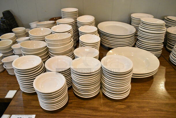 Wood Pattern Dining Height Table w/ Contents Including Ceramic Dishes. (main dining room) - Image 2 of 4