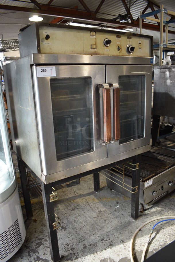 Stainless Steel Commercial Electric Powered Full Size Convection Oven w/ View Through Doors and Metal Oven Racks on Metal Legs. 208-240 Volts. 36x32x62