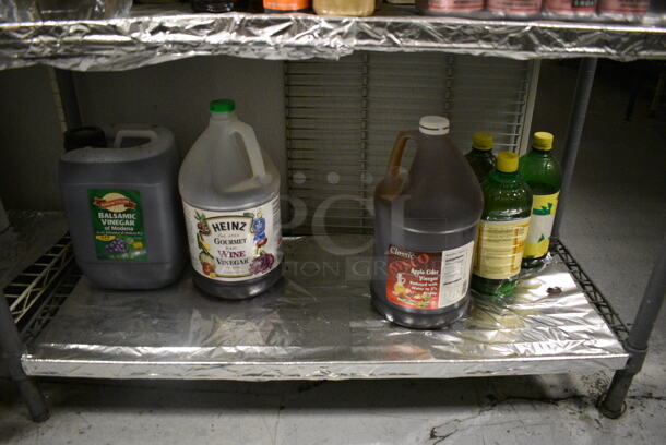 Gray Finish 4 Tier Wire Shelving Unit w/ Contents Including Seasonings. BUYER MUST REMOVE. BUYER MUST DISMANTLE. PCI CANNOT DISMANTLE FOR SHIPPING. PLEASE CONSIDER FREIGHT CHARGES. 36x14x54.5. (kitchen) - Image 3 of 9