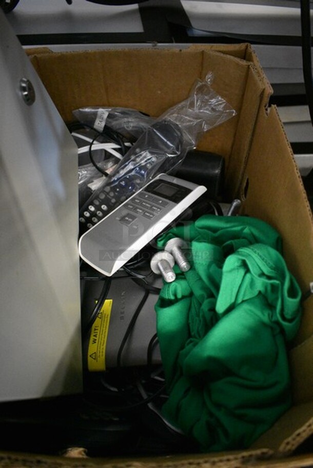 ALL ONE MONEY! Lot of Various Items Including a Security Tronix Box, Remote Controls and Green T-Shirt. - Image 3 of 4