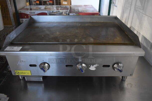 Qualite QLEG-36/NG Stainless Steel Commercial Countertop Natural Gas Powered Flat Top Griddle. 90,000 BTU. 36x25x15