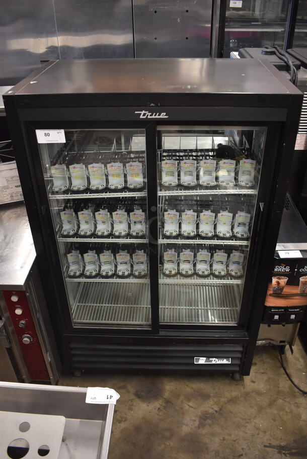 2017 True GDM-33CPT-LD Commercial Black Two-Door Merchandiser Cooler With Polycoated Shelves and Black Drink Dividers. 115V, 1 Phase. Tested and Powers On But Does Not Get Cold