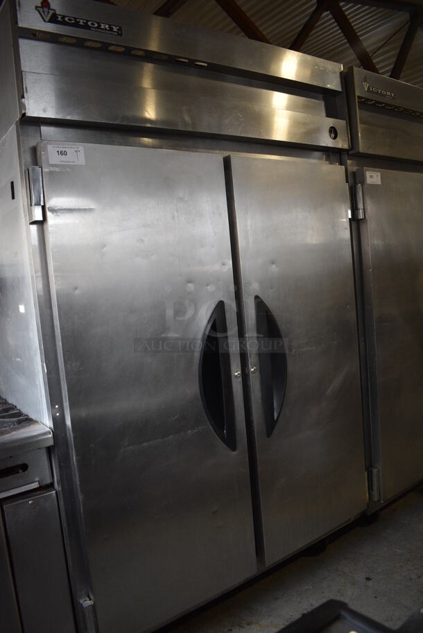 Victory Model VR-2 Stainless Steel Commercial 2 Door Reach In Cooler w/ Poly Coated Racks on Commercial Casters. 115 Volts, 1 Phase. 52x34x84. Tested and Powers On But Temps at 51 Degrees